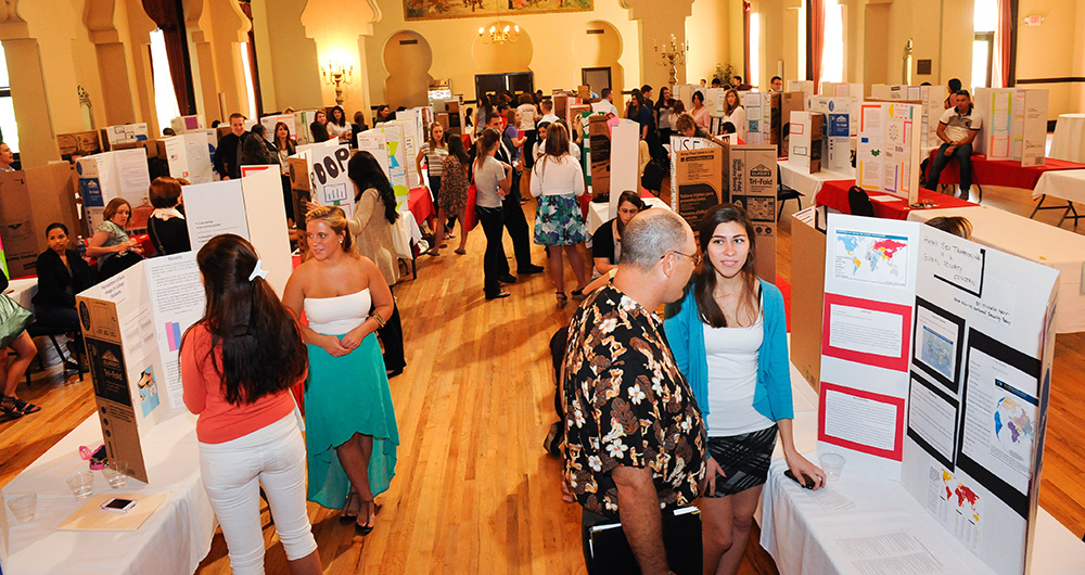 Students doing poster presentations