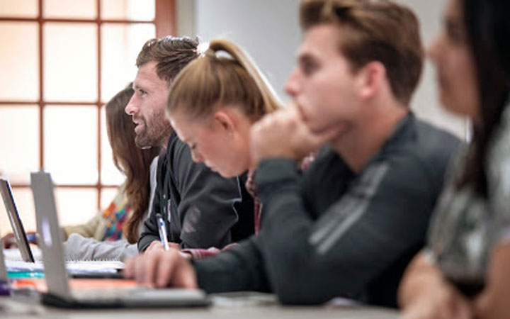 Students using laptops in class