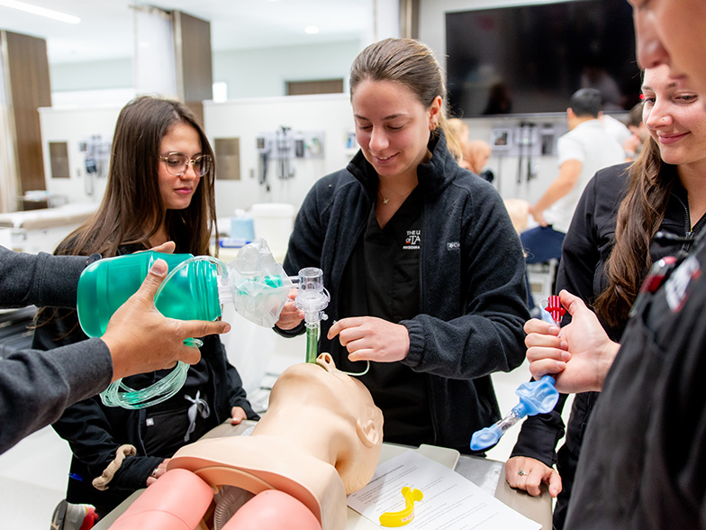 Two Physician Assistant Medicine students practice their studies. 