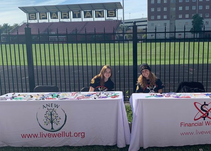 Students at an ANEW tabling event