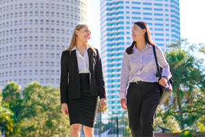 Students in professional attire walking on campus