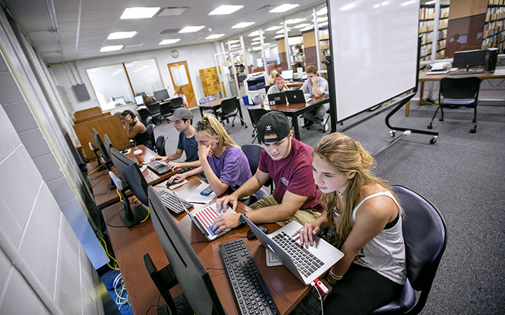 Students doing work on a computers