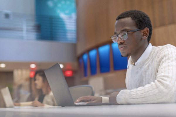 Student on laptop in ICB