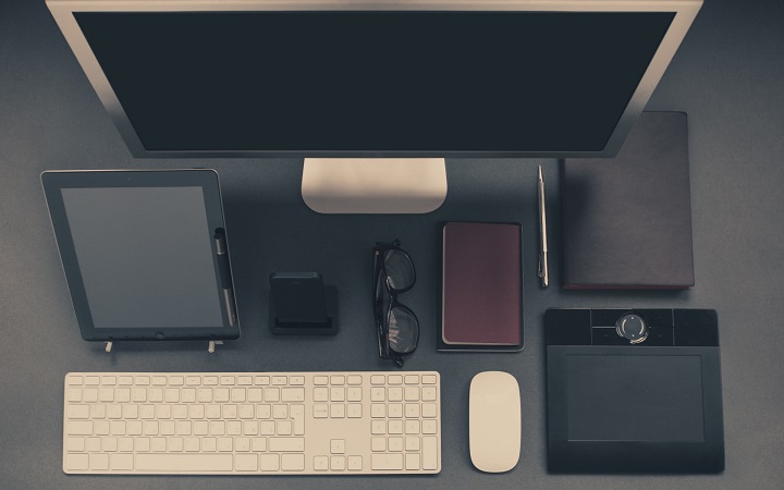 Desk with different devices on it