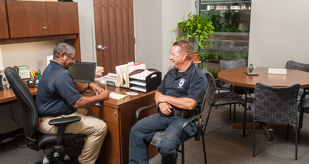 Campus Safety officers sitting at a desk