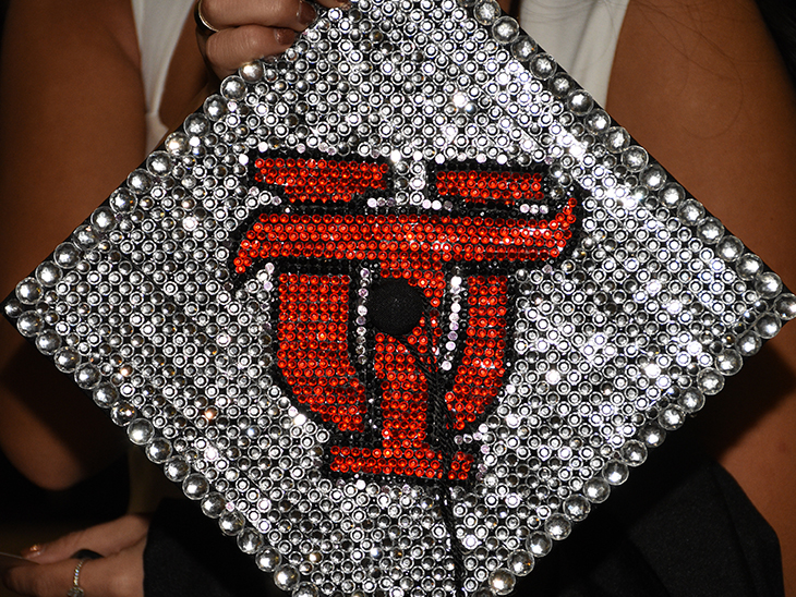 Bedazzled graduation cap that says UT