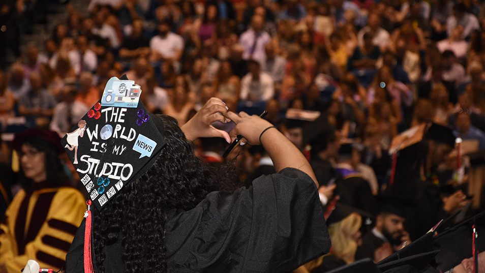 Graduate facing the crowd