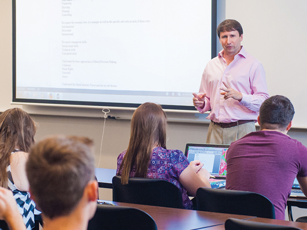 Professor teaching to a room full of students