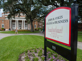 The sign outside the Sykes College of Business.