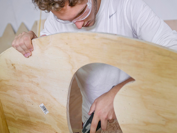 Man carving wood