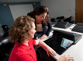 A classroom with computer work stations in the College of Business.