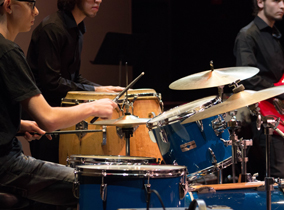 Students playing the drums