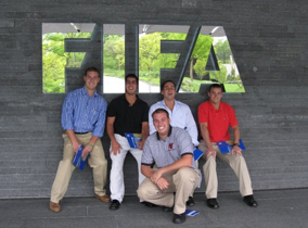 Students standing in front of a FIFA sign 
