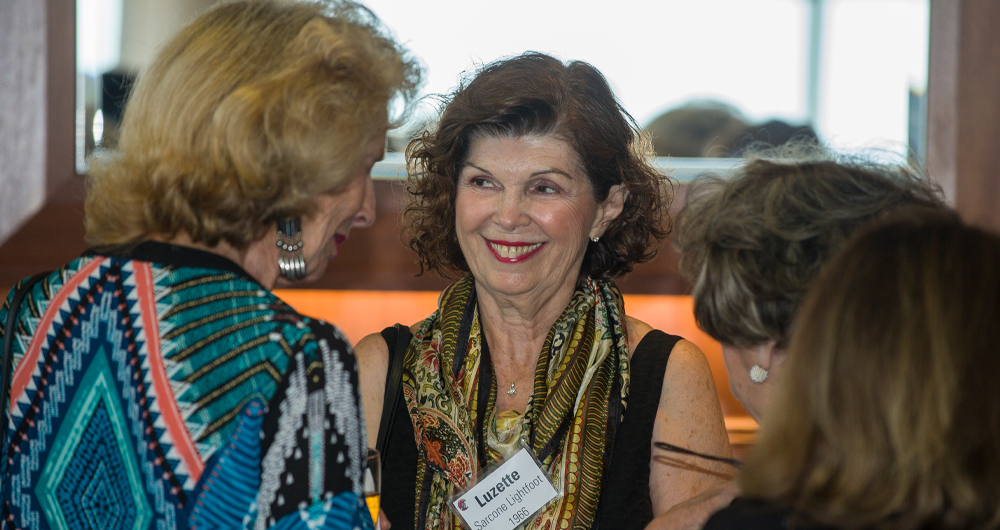 Alumni talking at Golden Spartan event