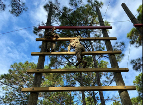 ROTC cadets on an obstacle course