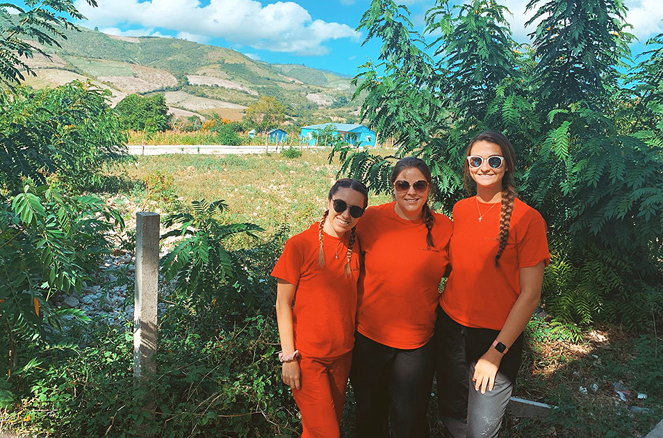 Two students and a faculty member in the Dominican Republic.