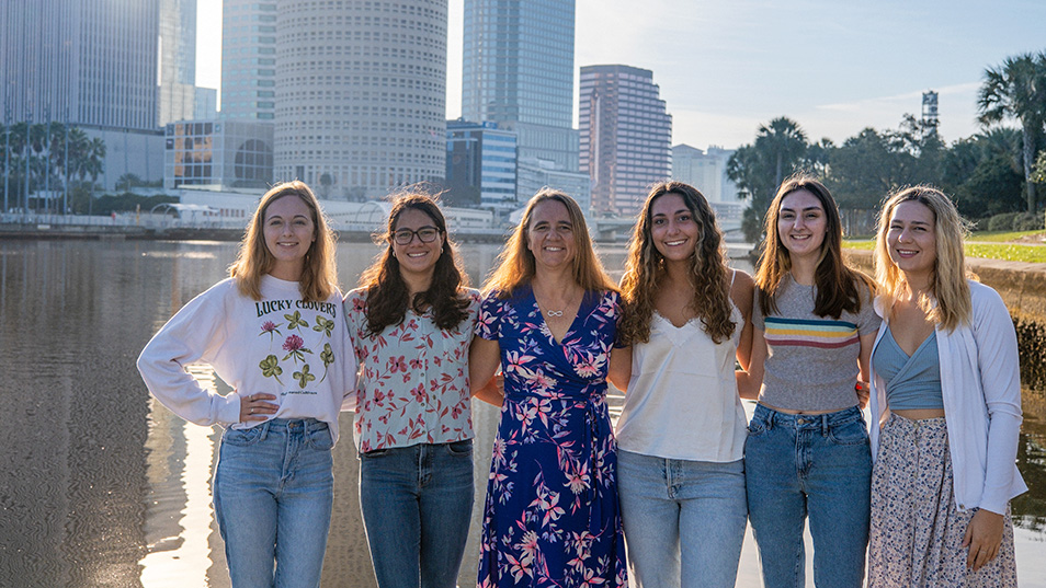 Froeschke surrounded by her students