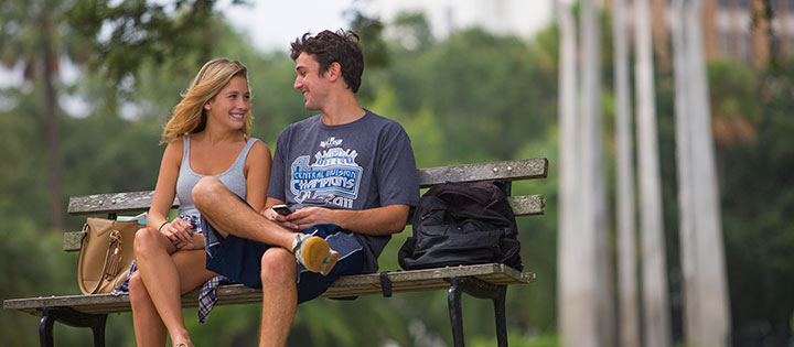 Two students sitting on a bench